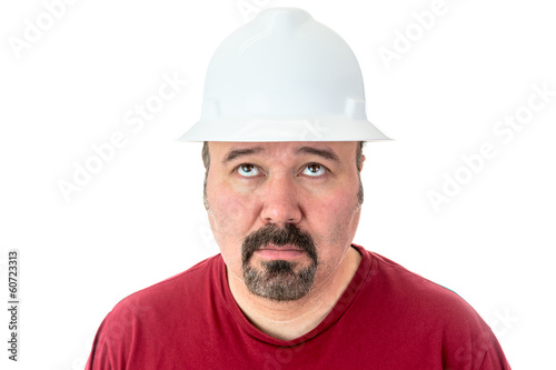 Glum looking workman looking for inspiration
