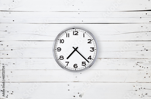 Clock on a white plank