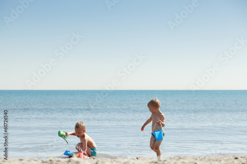Two children playing on the beach