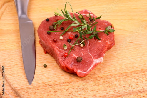 Juicy beef steak with spices and herbs