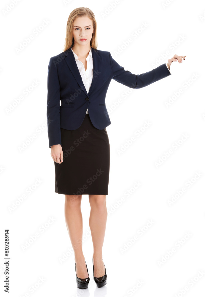 Beautiful caucasian business woman holding hand on empty space. Beautiful caucasian business woman holding hand on empty space.