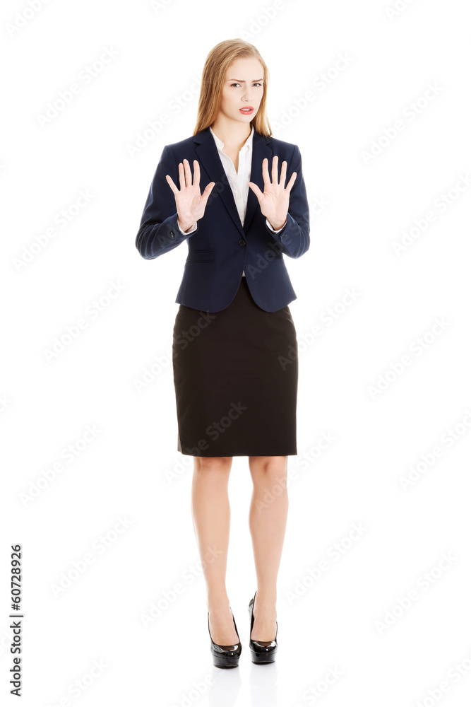 Beautiful caucasian business woman is showing refusing, rejectin
