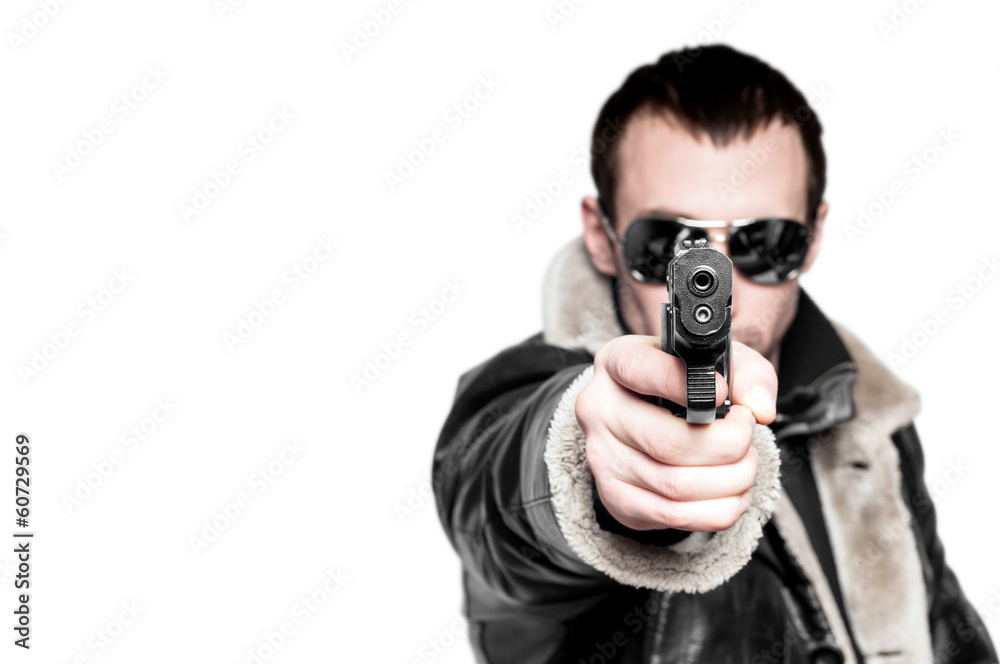 Man with gun in sunglasses. Isolated on white background. Man with gun in sunglasses. Isolated on white background.