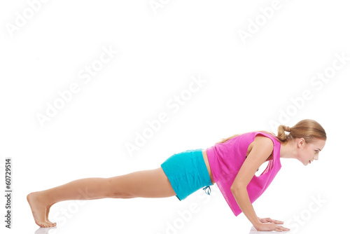 Beautiful caucasian woman is exercising.