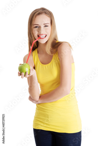 Beautiful caucasian casual slim woman drinking juice from an app