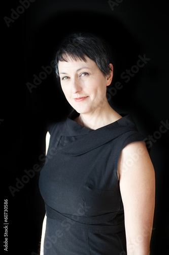 Obraz na płótnie Beautiful Woman with Short Hair on Black Background w salonie