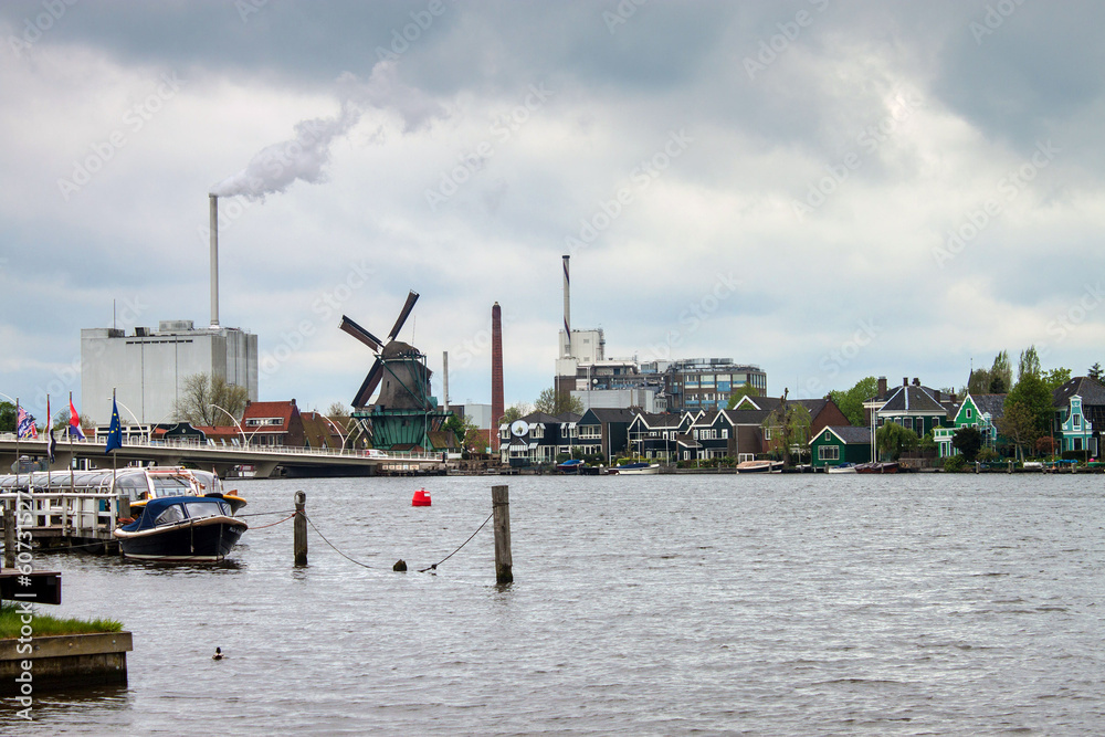 Factory with a chimney and wind mills near Zaanse Schans