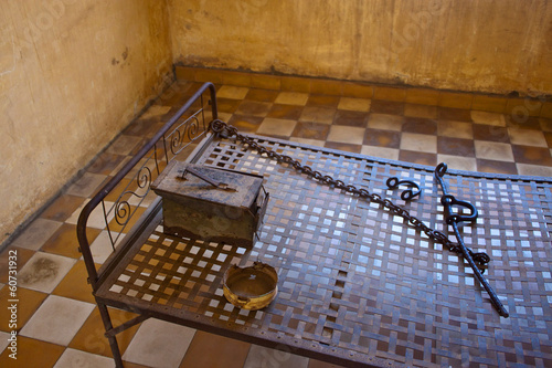 Bed in a cell in Tuol Sleng  (S21) Prison, Phnom Penh, Cambodia photo