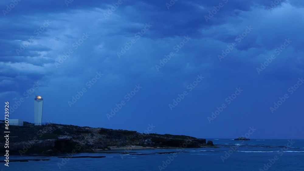 Lighthouse and storm cloudscape Lighthouse and storm cloudscape