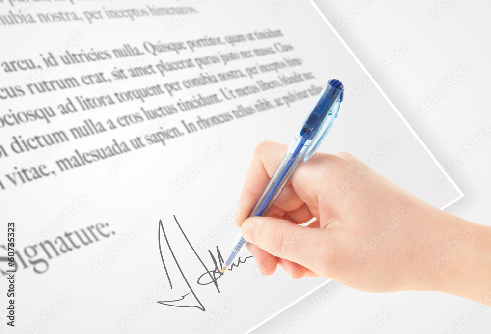 Hand writing personal signature on a paper form Hand writing personal signature on a paper form