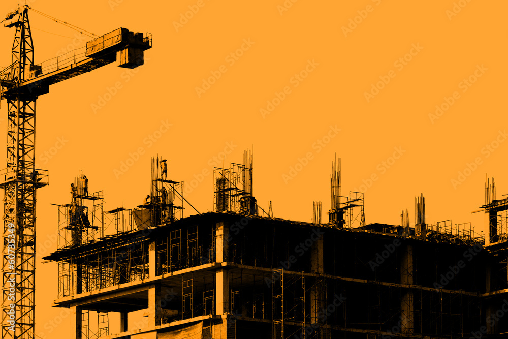Construction site, silhouettes of workers