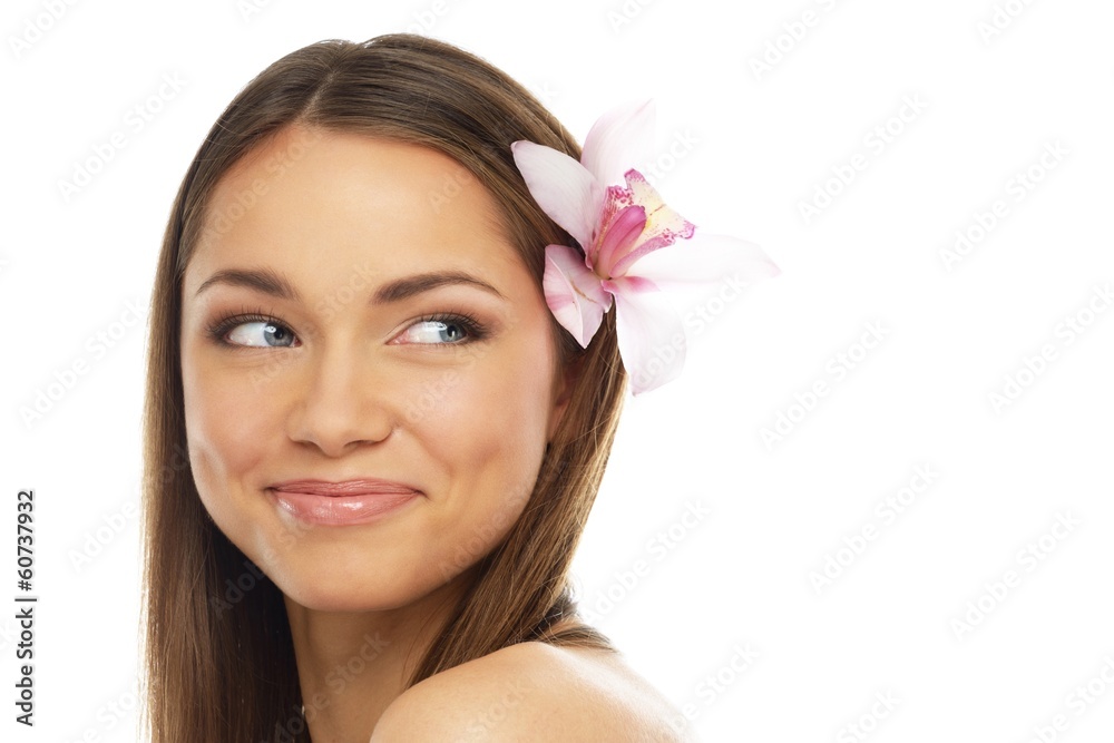 Young beautiful brunette woman with orchid flower Young beautiful brunette woman with orchid flower