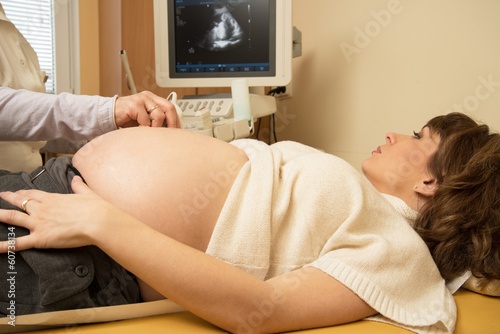 Young pregnant woman on ultrasound examination at hospital