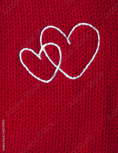 two white heart embroidered handmade on red canvas