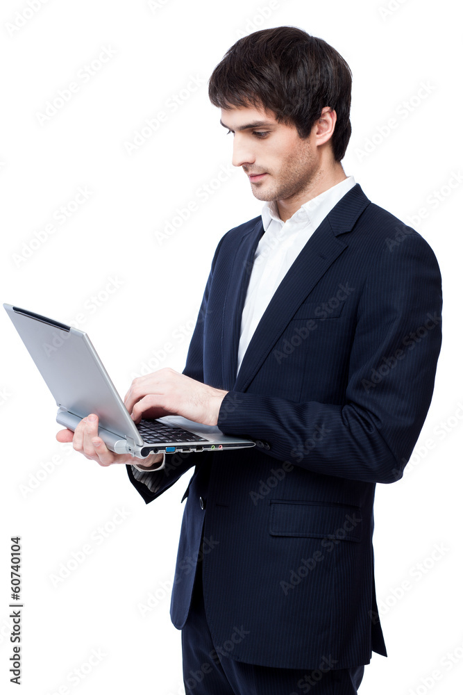 Young businessman use laptop on white background. Young businessman use laptop on white background.