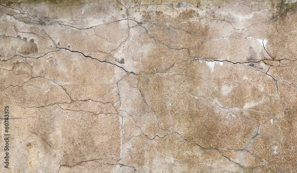 Background texture of old yellow wall with stucco and cracks
