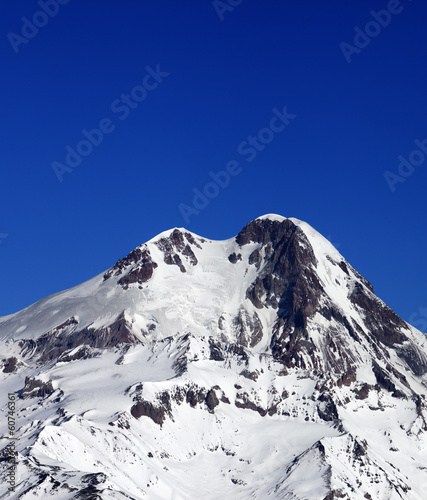 Top of Mount Kazbek at sun winter day