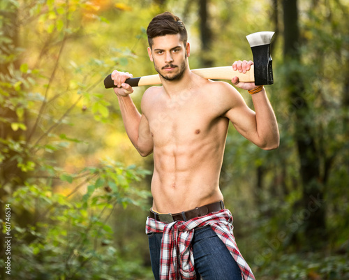 фотографія Sexy lumberjack in forest
