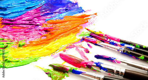 Paints and brushes isolated on a white