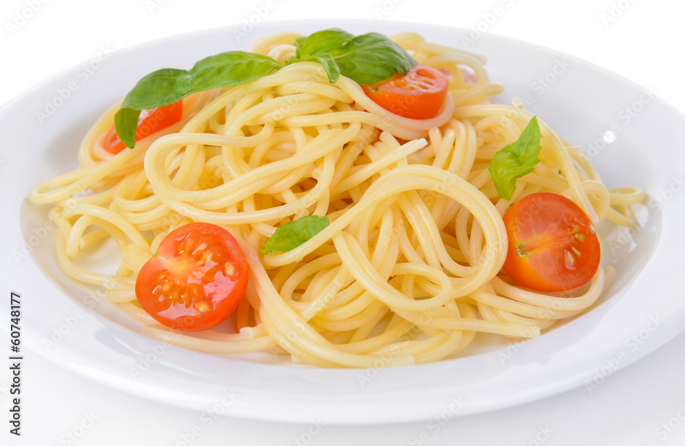 Delicious spaghetti with tomatoes on plate close-up Delicious spaghetti with tomatoes on plate close-up