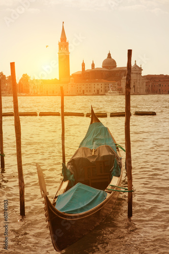 Sunset view of Venice with gondola on Grand Canal © artjazz