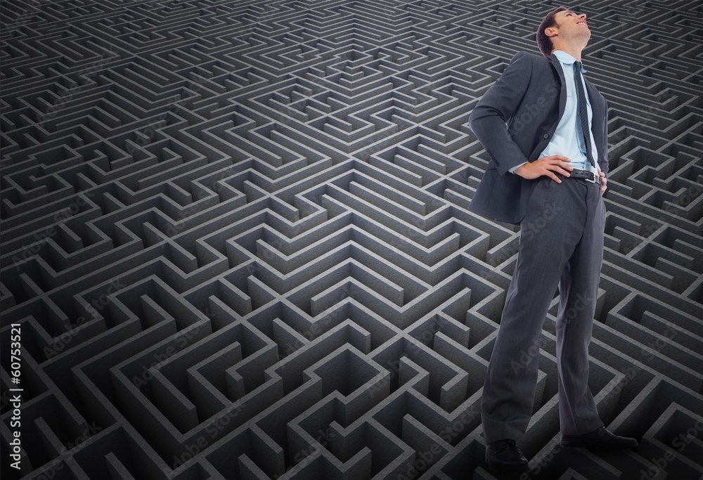 Composite image of happy businessman with hands on hips Composite image of happy businessman with hands on hips