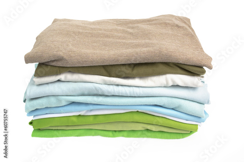 A stack of folded shirts on white background