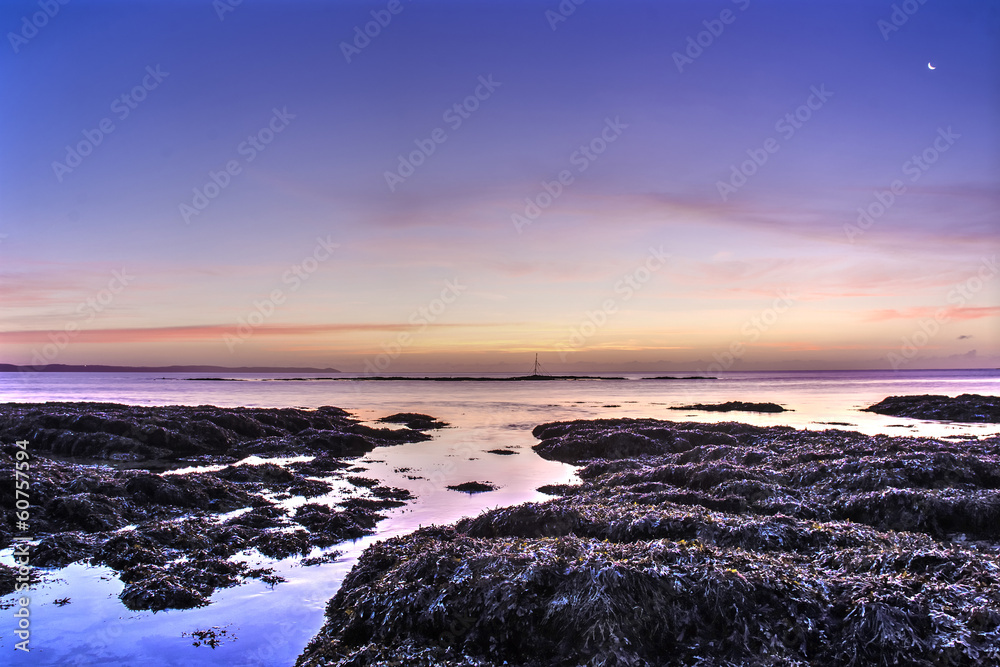 Fototapeta premium Hannafore point pink sunrise with crescent moon