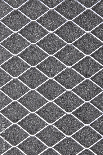 Metal grid on gray background