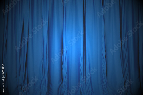 Blue closed the curtain, lit by a spotlight