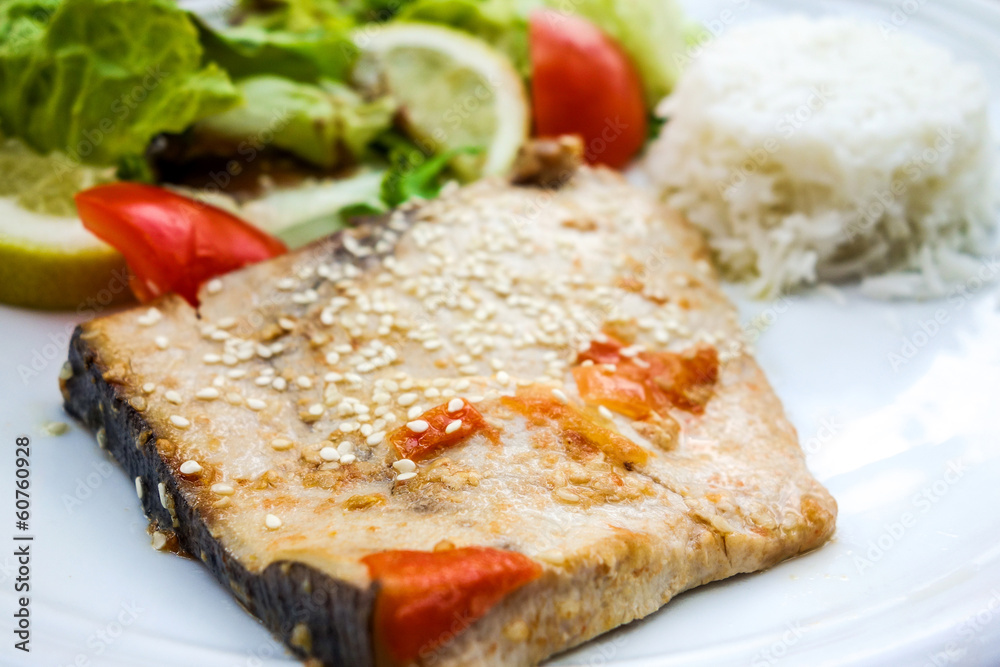 close-up of plate of rice and smoked salmon with tomato