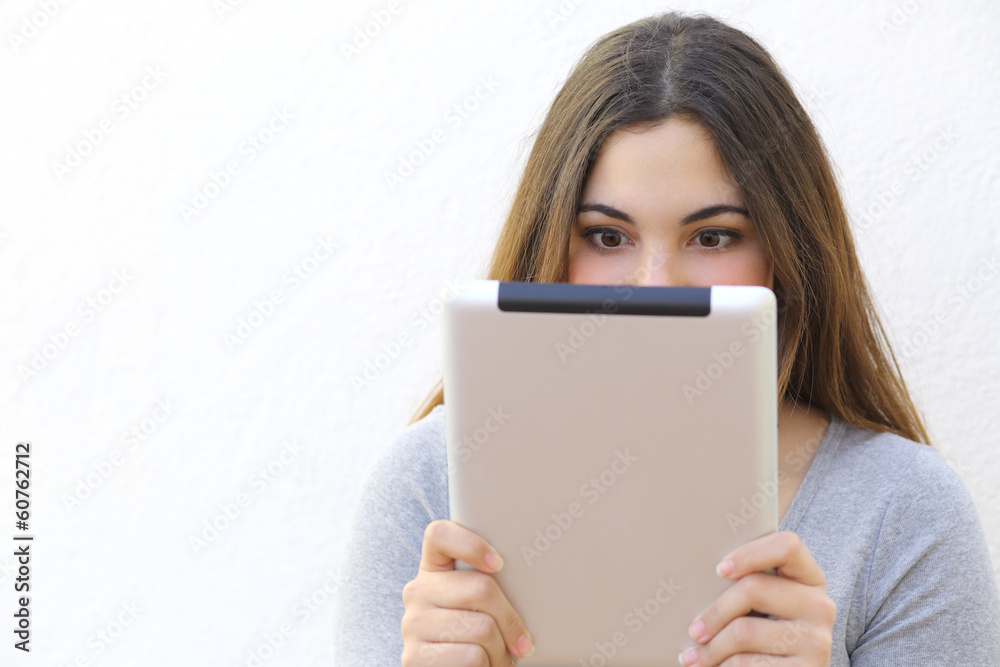 Internet addiction woman reading a tablet reader Internet addiction woman reading a tablet reader