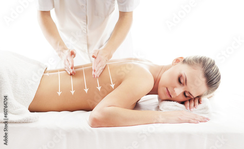 A beautiful and healthy woman getting alternative massage