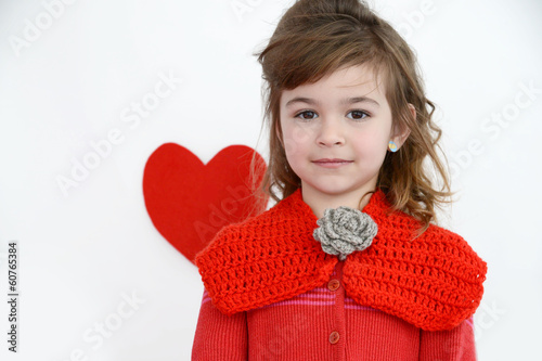 Beautiful girl with red crochet collar and red heart photo