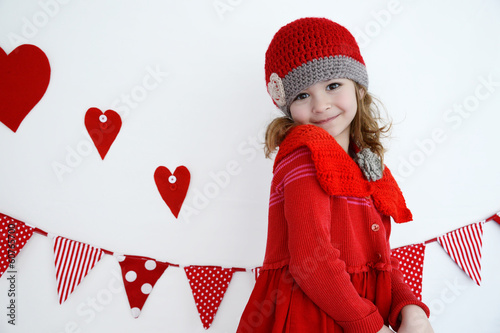 Beautiful girl with picnic basket in red photo