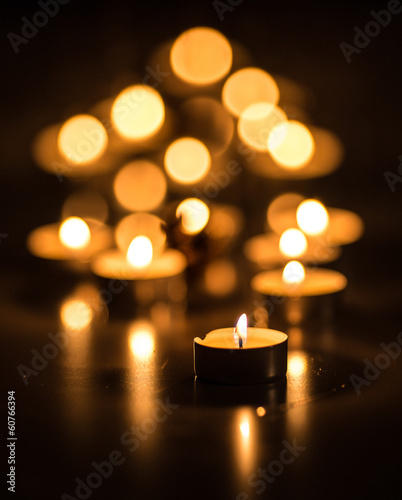 Candles on a dark background with bokeh