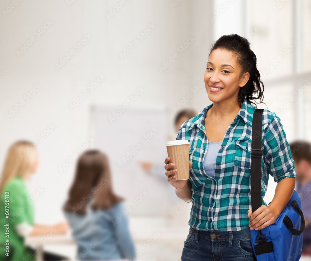 smiling student with bag and take away coffee cup smiling student with bag and take away coffee cup