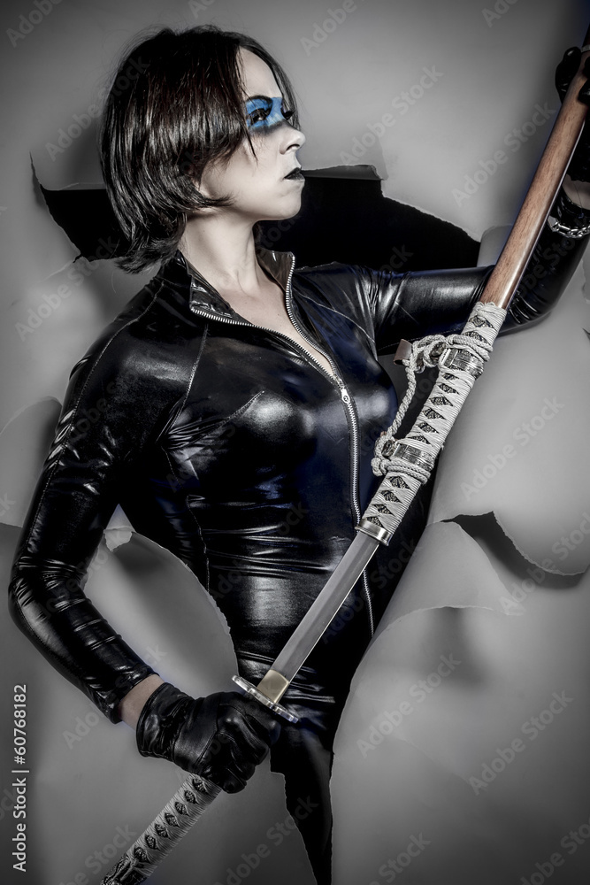 Girl with katana sword. in black latex, comic sty Stock Photo | Stock