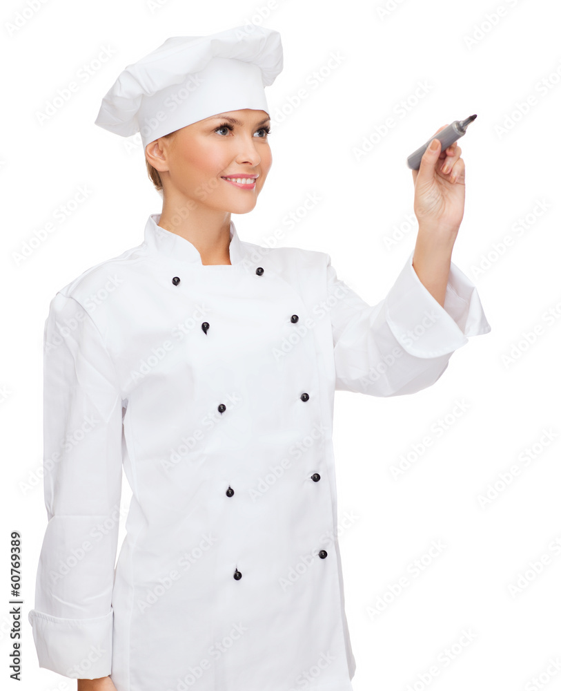 smiling female chef writing something on air smiling female chef writing something on air