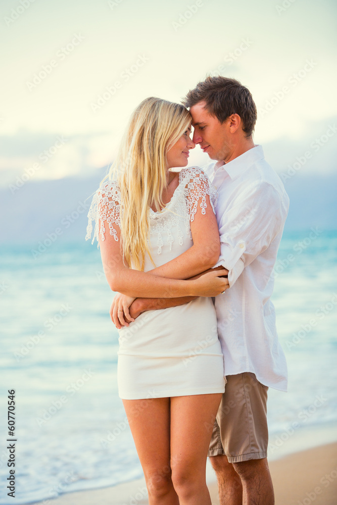 Couple Enjoying Sunset on the Beach Couple Enjoying Sunset on the Beach