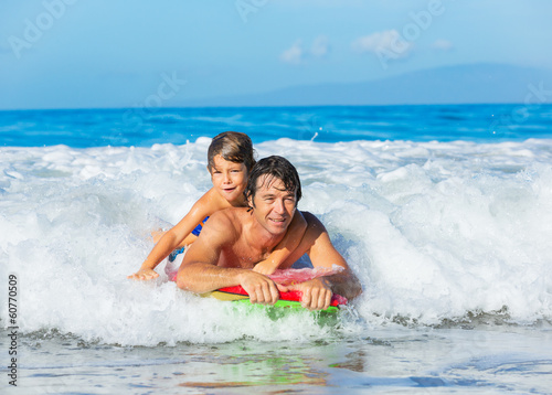 Father and Son Surfing Tandem Togehter Catching Ocean Wave, Care