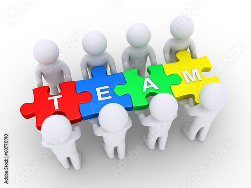 People holding a team puzzle