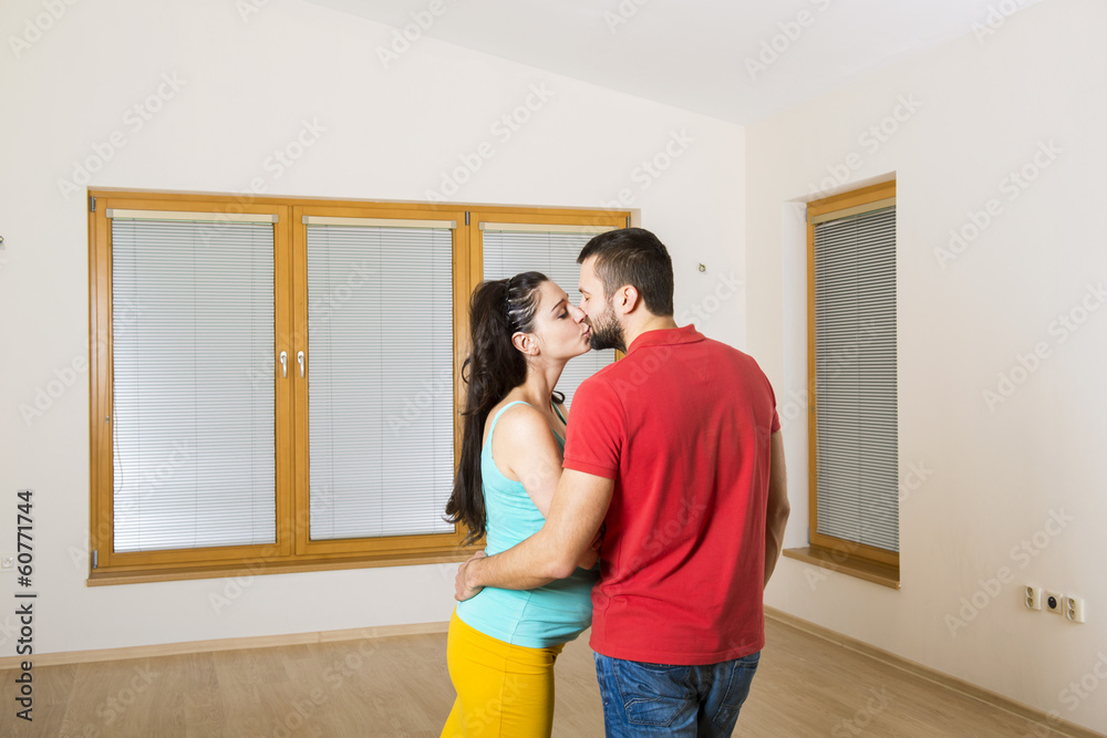 Pregnant mother and happy father in new house Pregnant mother and happy father in new house