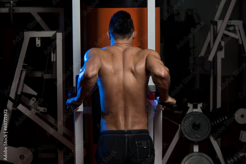 Young Man Doing Exercise For Triceps Young Man Doing Exercise For Triceps