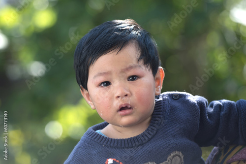 little cute child with tears on face