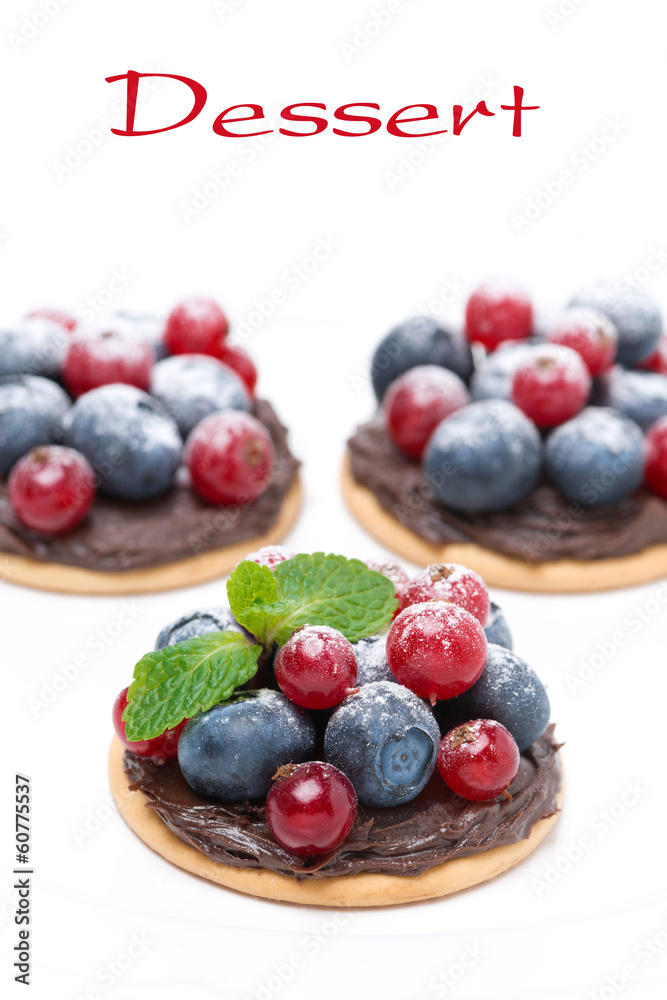 mini cakes with chocolate cream and berries mini cakes with chocolate cream and berries