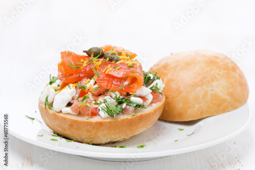 sandwich with cheese, tomato and salmon on the plate