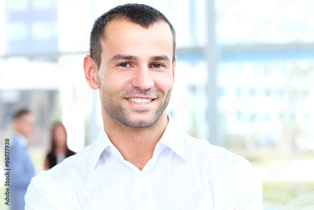 Happy smart business man with team mates discussing Happy smart business man with team mates discussing