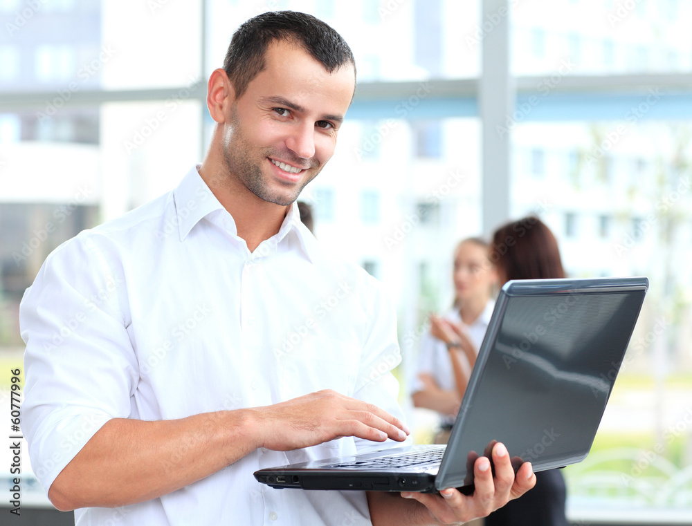 smart business man using laptop with colleagues smart business man using laptop with colleagues