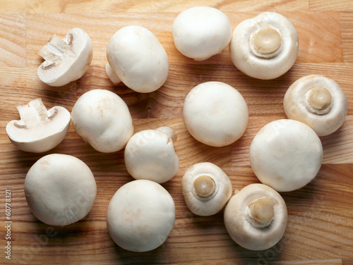 Champignons on wooden background
